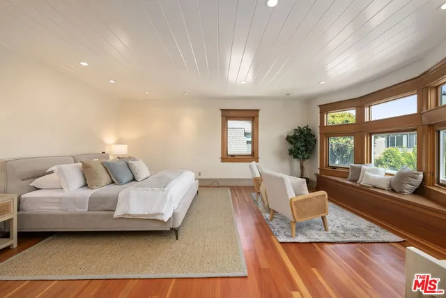 a view of a patio with table and chairs and potted plants