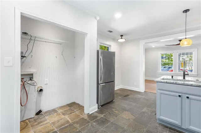 a bathroom with a double vanity sink mirror and shower