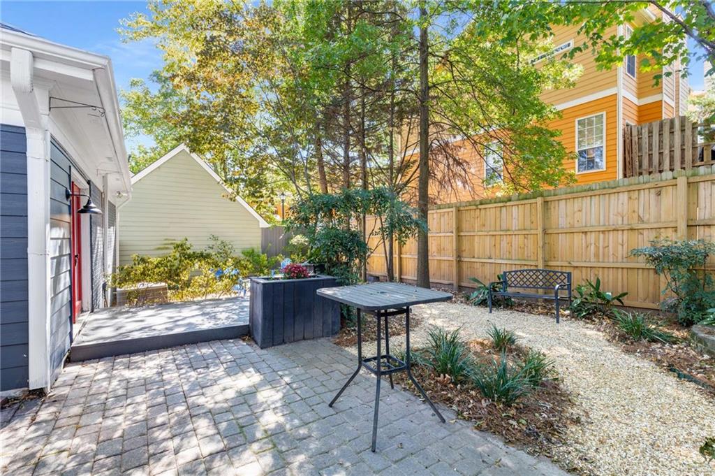 216 Haralson Avenue Northeast Atlanta, GA 30307 - Photo 27 of 34 a view of a patio with table and chairs and potted plants
