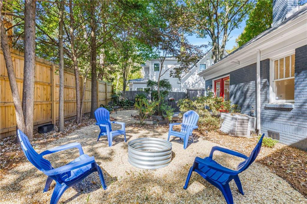216 Haralson Avenue Northeast Atlanta, GA 30307 - Photo 31 of 34 a view of a chairs and table in backyard of the house