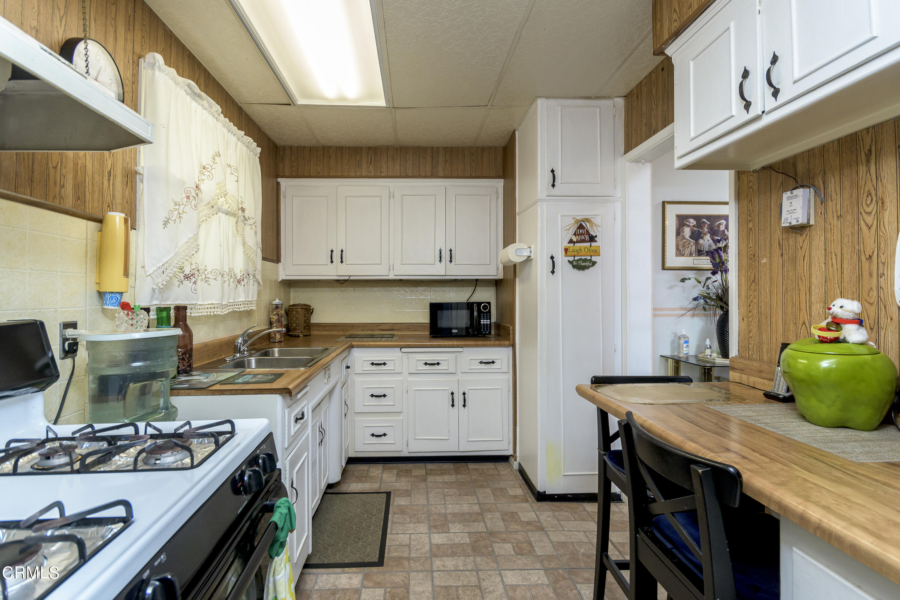 3279 Laurice Avenue Altadena, CA 91001 - Photo 11 of 24 a kitchen with a stove a sink and cabinets