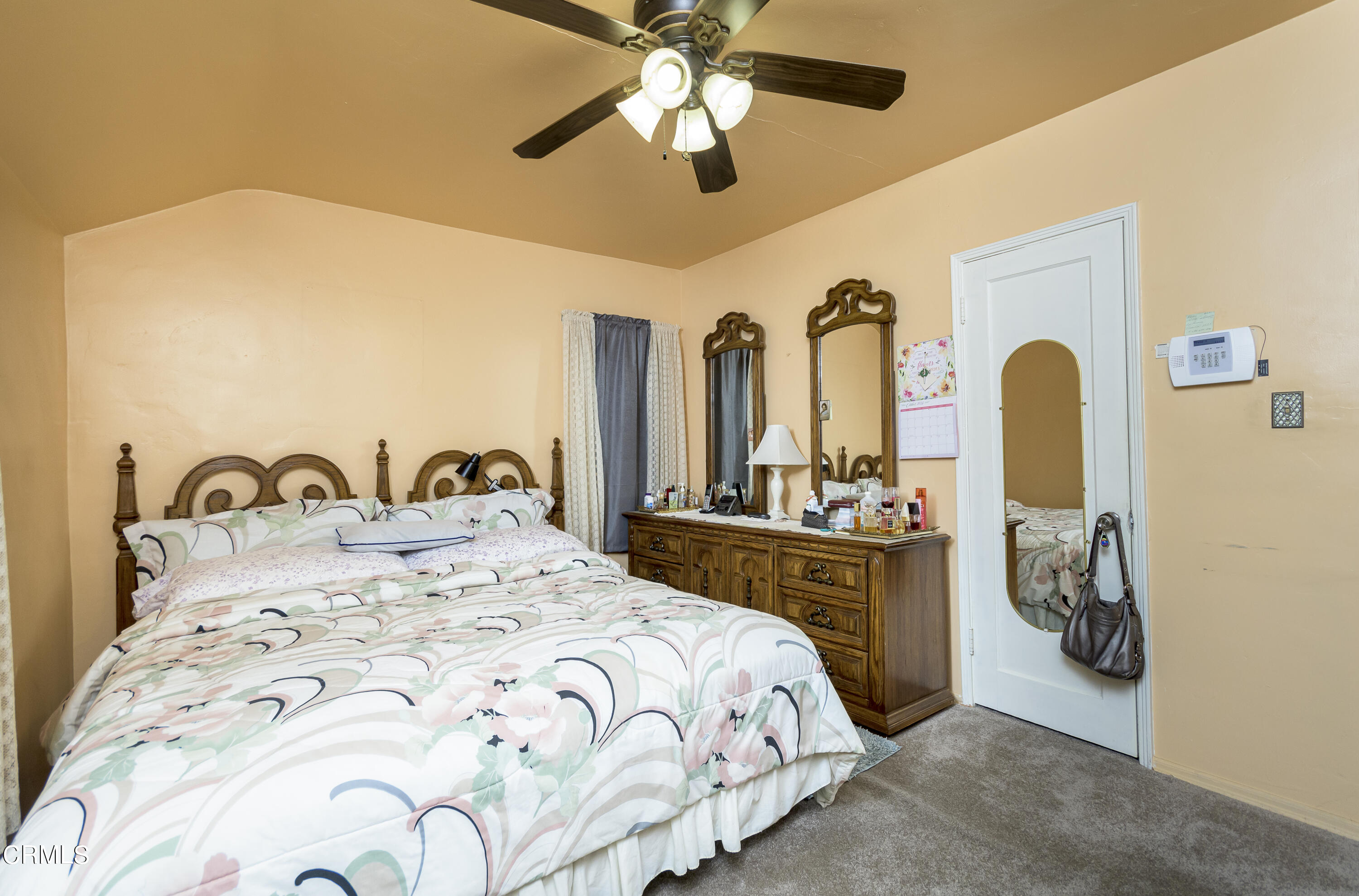 3279 Laurice Avenue Altadena, CA 91001 - Photo 13 of 24 a bedroom with a bed a table and potted plants