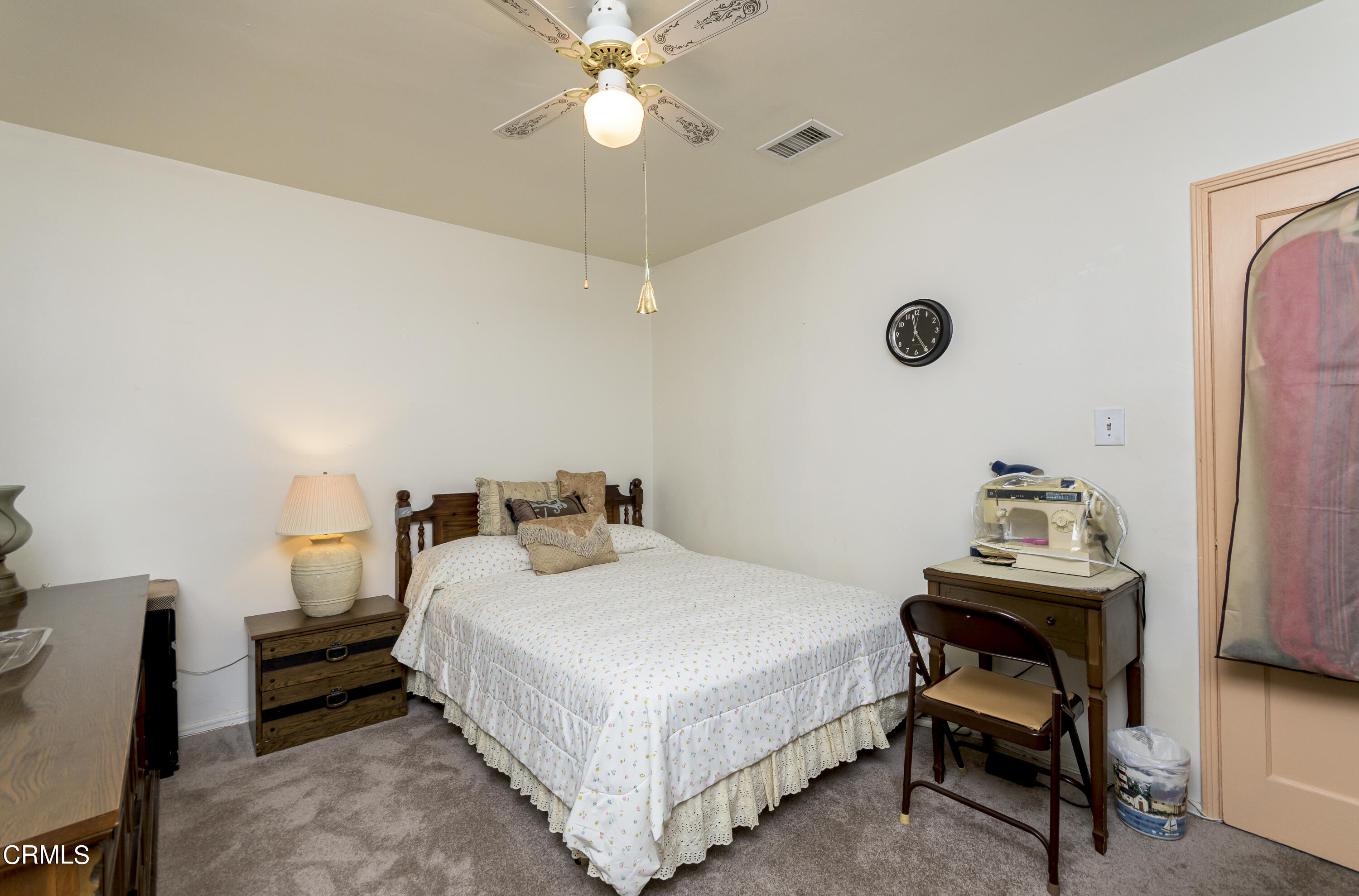 3279 Laurice Avenue Altadena, CA 91001 - Photo 15 of 24 a bedroom with a bed and a table in it