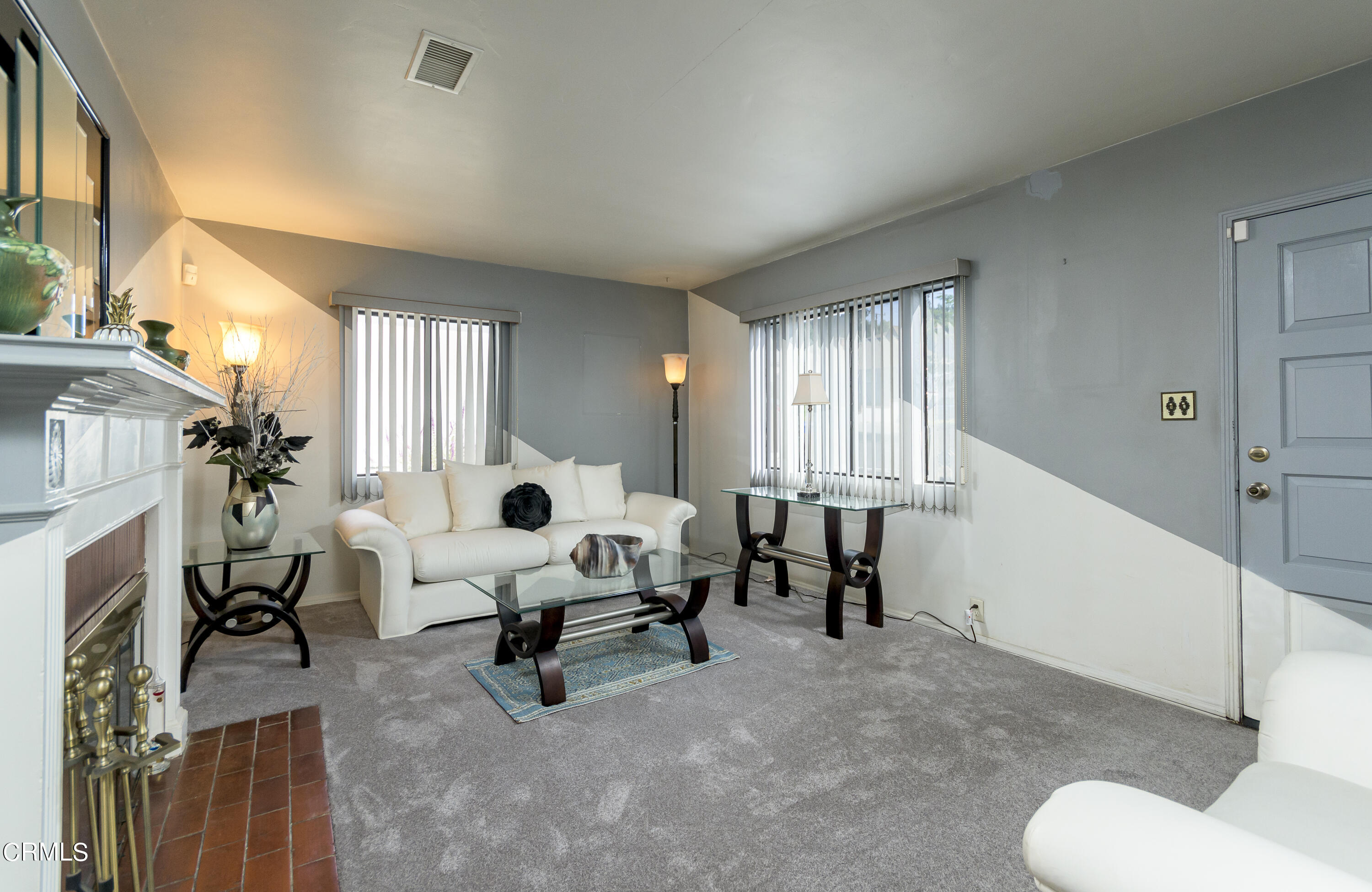 3279 Laurice Avenue Altadena, CA 91001 - Photo 3 of 24 a living room with furniture and a fireplace