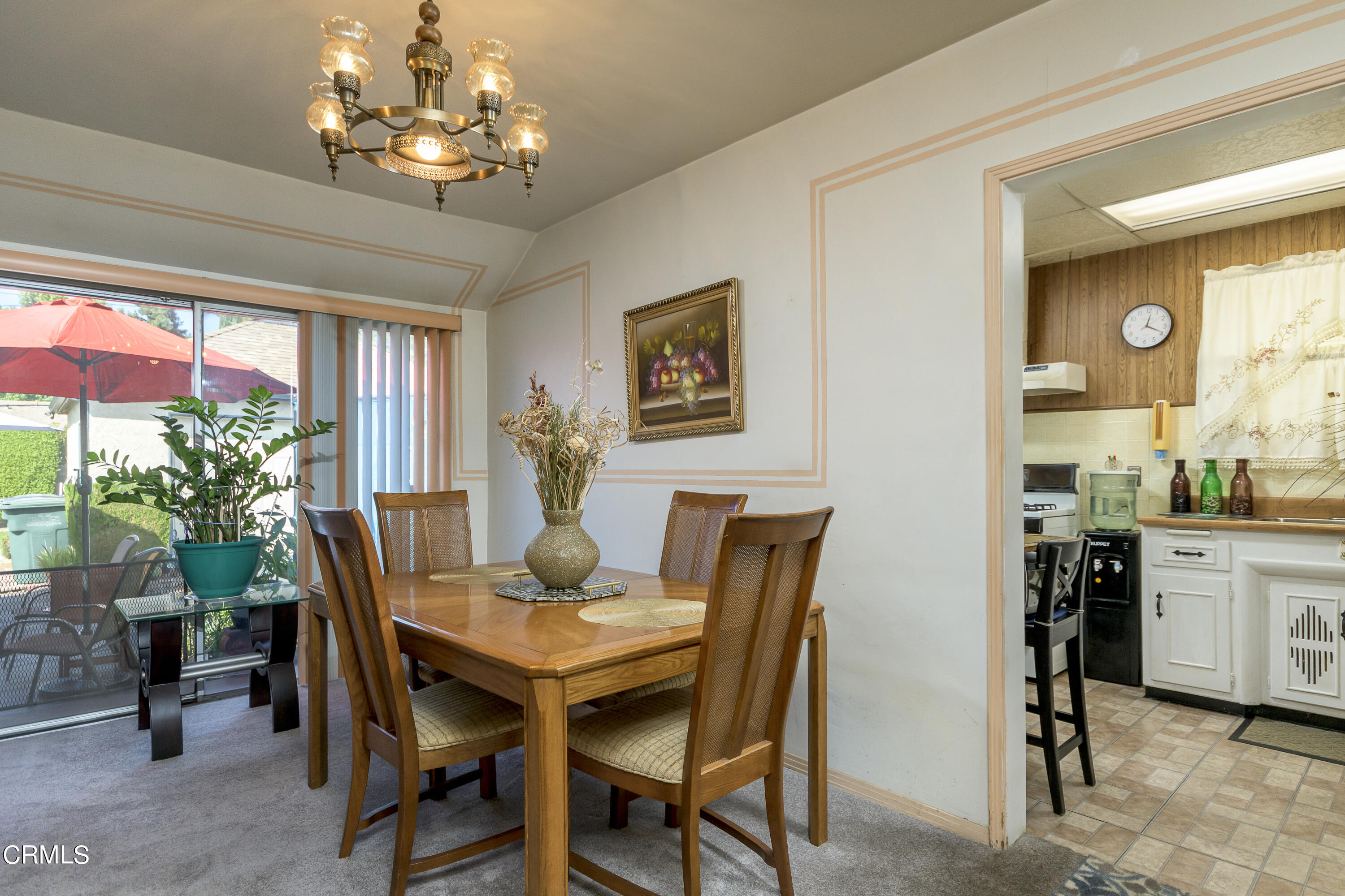 3279 Laurice Avenue Altadena, CA 91001 - Photo 9 of 24 a view of a dining room with furniture and a chandelier