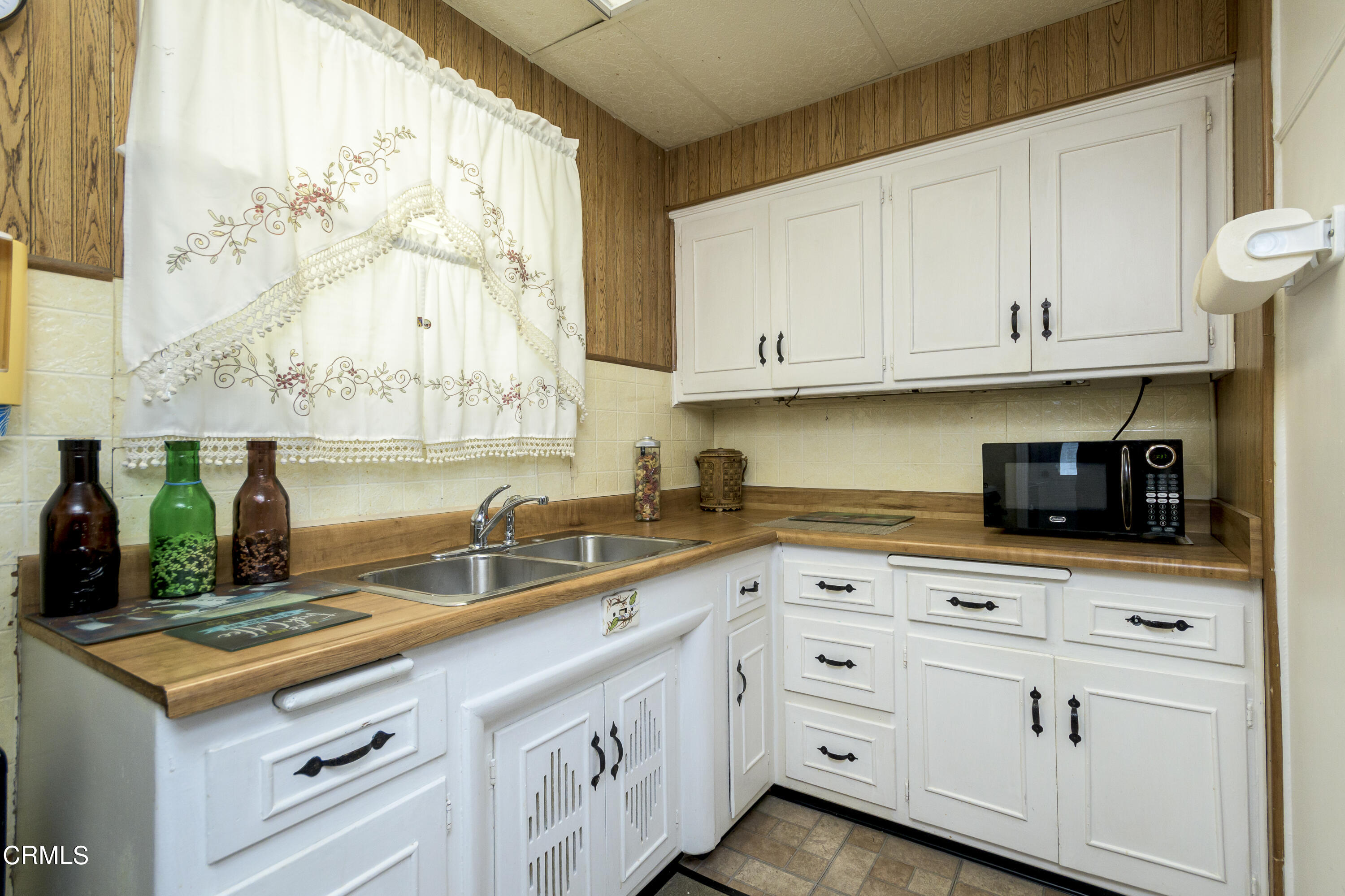 3279 Laurice Avenue Altadena, CA 91001 - Photo 10 of 24 a kitchen with stainless steel appliances granite countertop a sink and cabinets