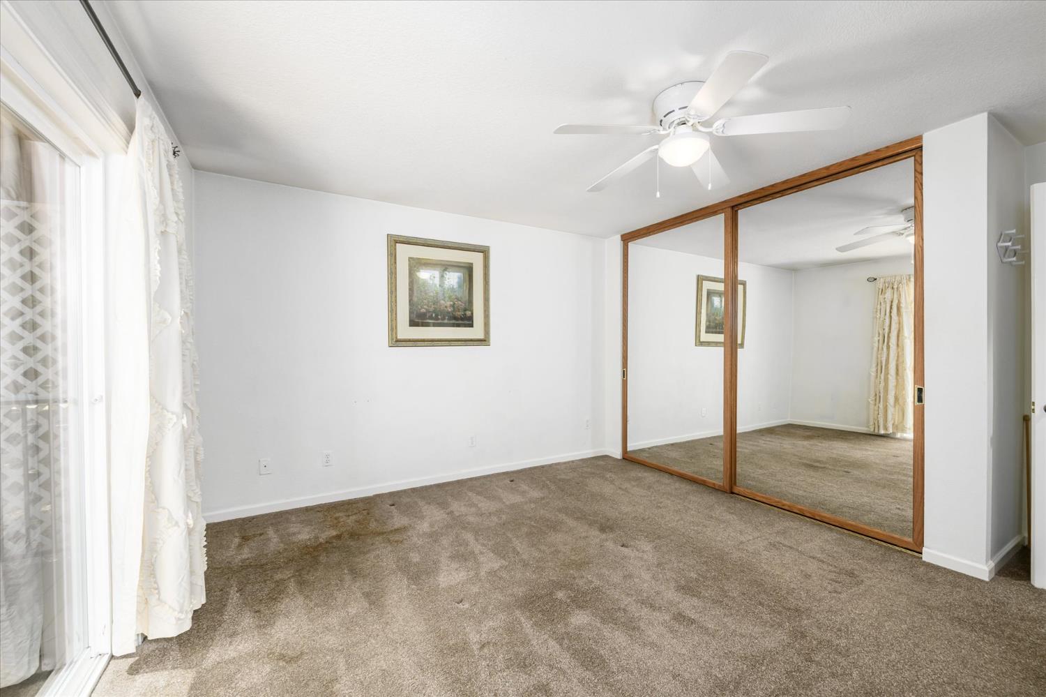 6480 Granite Trail Pollock Pines, CA 95726 - Photo 13 of 23 an empty room with fan and windows
