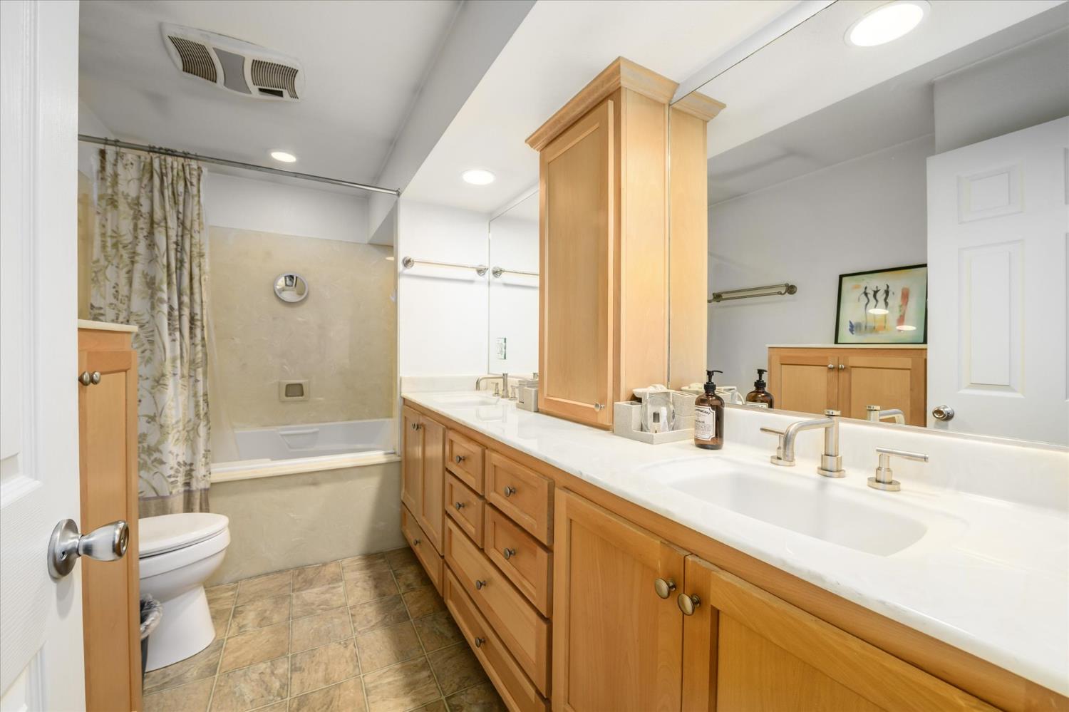 6480 Granite Trail Pollock Pines, CA 95726 - Photo 14 of 23 a bathroom with a double vanity sink toilet mirror and bathtub