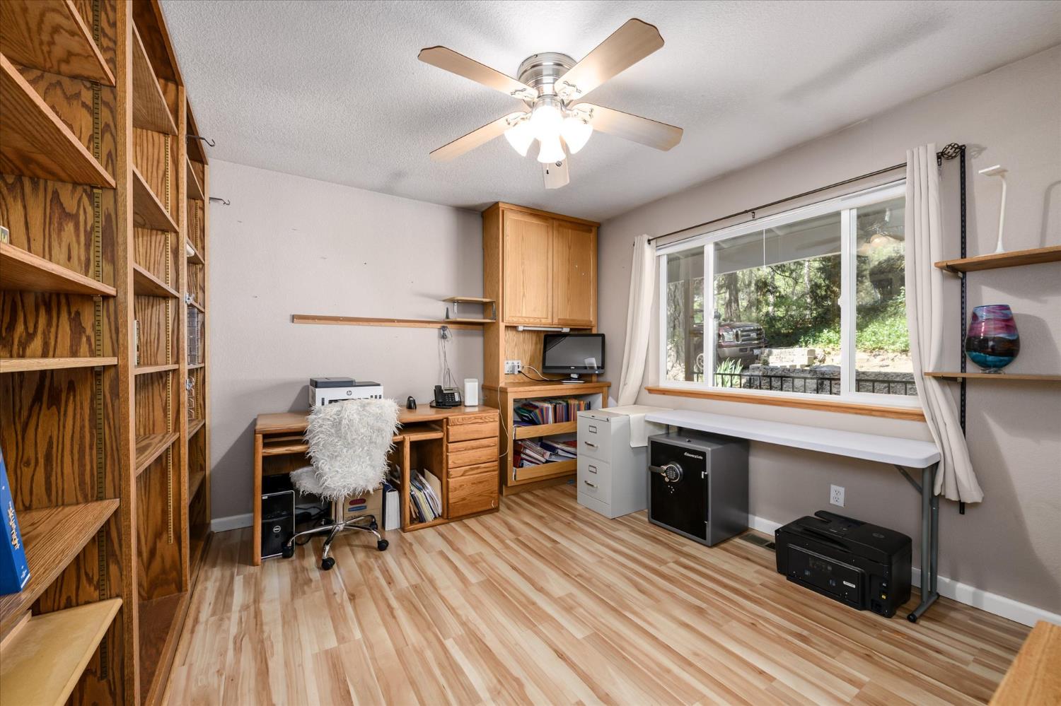 6480 Granite Trail Pollock Pines, CA 95726 - Photo 16 of 23 a view of a workspace with furniture and a window