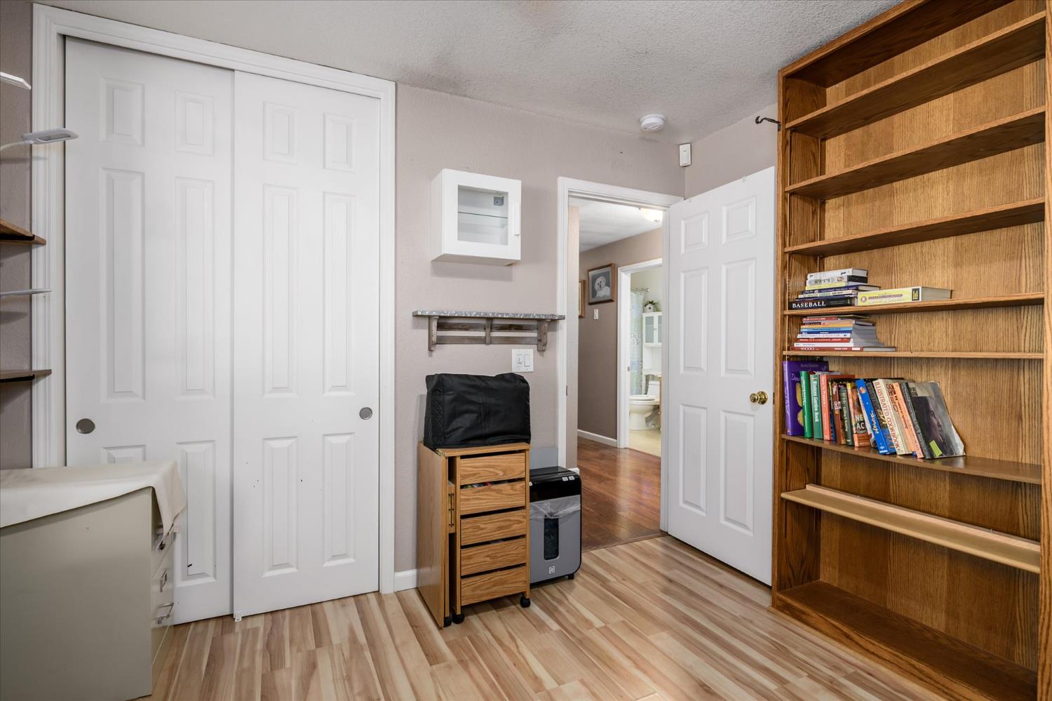 6480 Granite Trail Pollock Pines, CA 95726 - Photo 17 of 23 a view of walk in closet with clothes and shoes