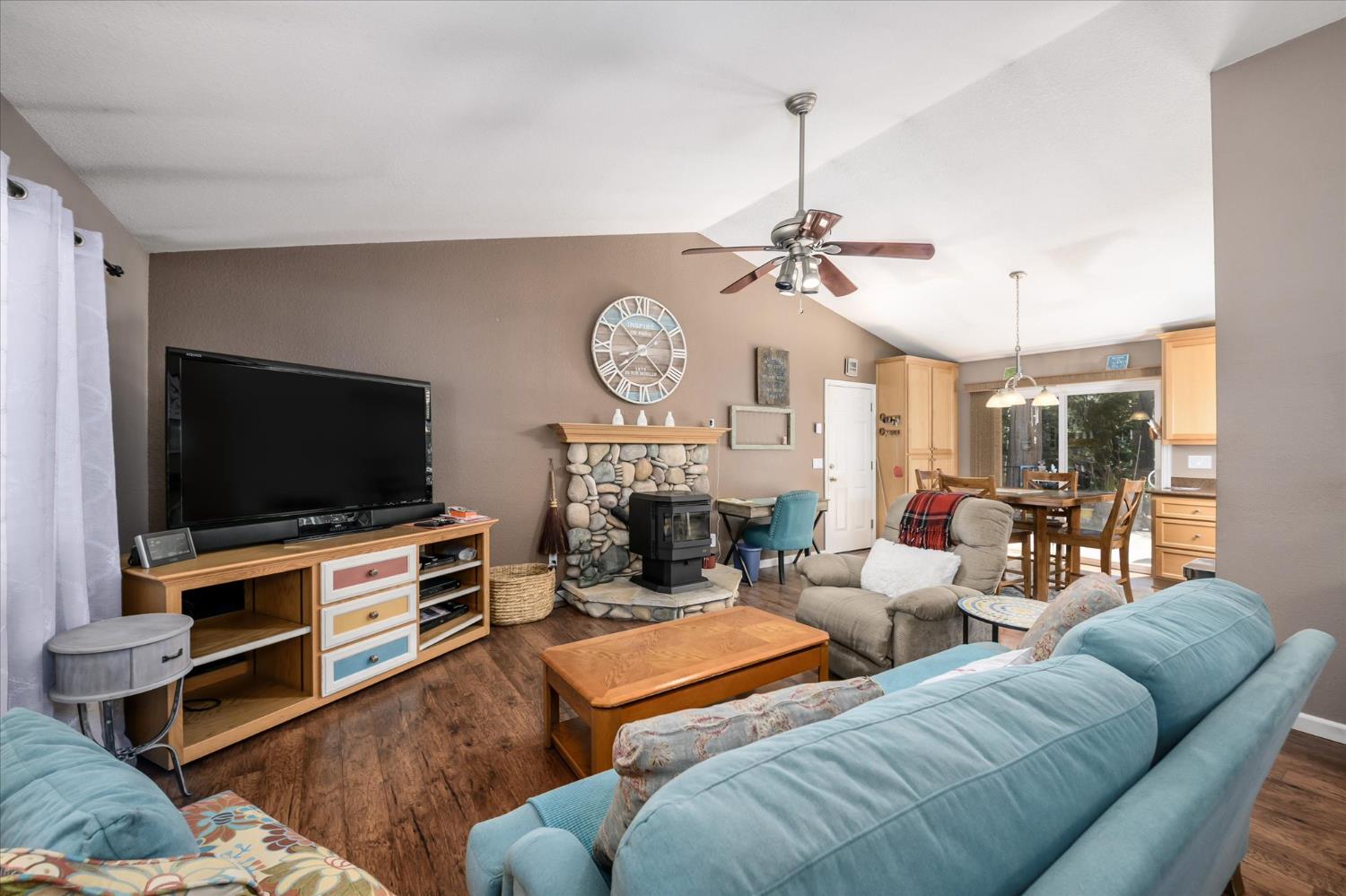 6480 Granite Trail Pollock Pines, CA 95726 - Photo 5 of 23 a living room with furniture and a flat screen tv