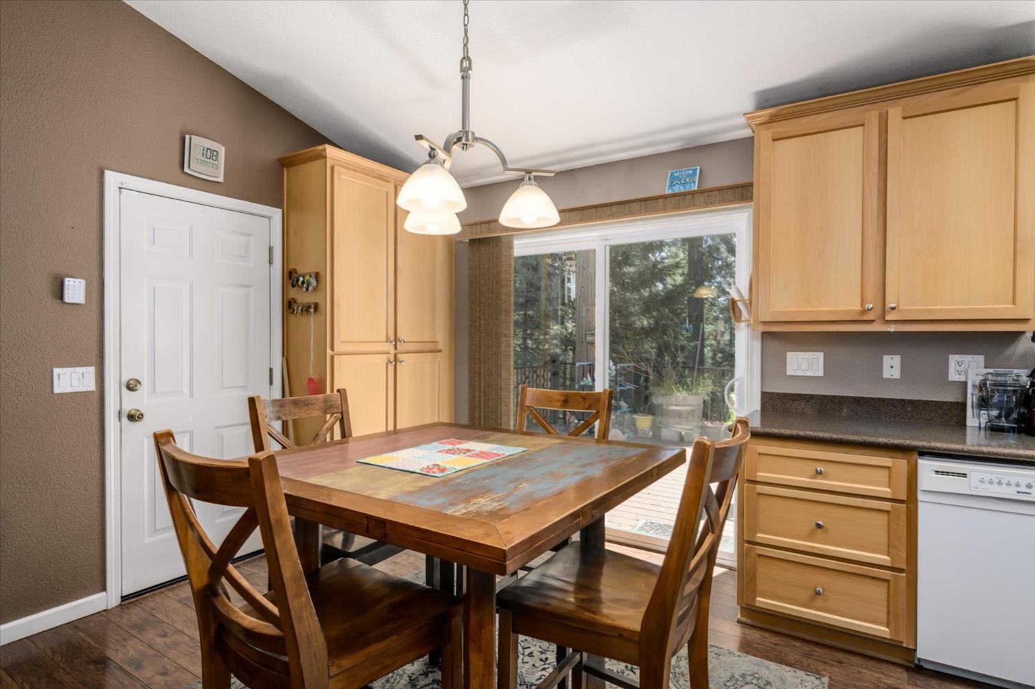 6480 Granite Trail Pollock Pines, CA 95726 - Photo 8 of 23 a view of a dining room with furniture window and outside view