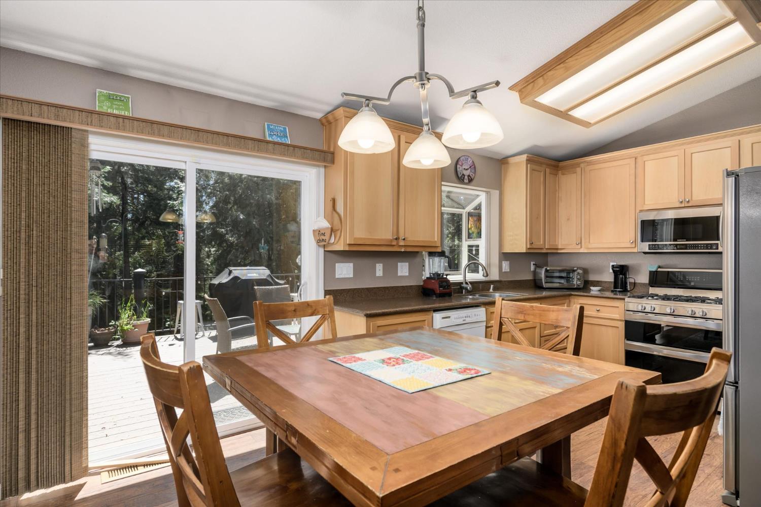 6480 Granite Trail Pollock Pines, CA 95726 - Photo 9 of 23 a view of a dining room with furniture window and outside view