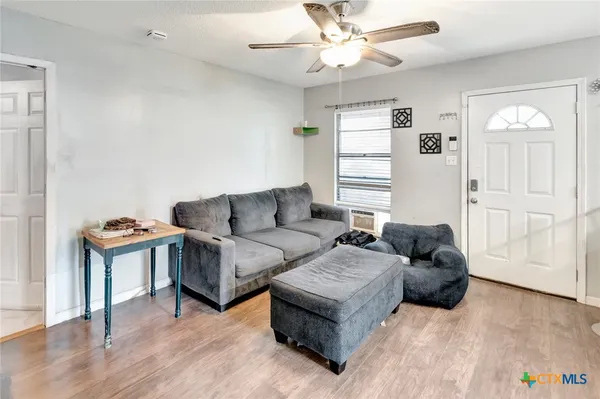 a living room with furniture and a window