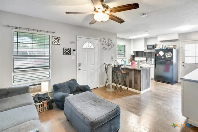 a living room with furniture and a window