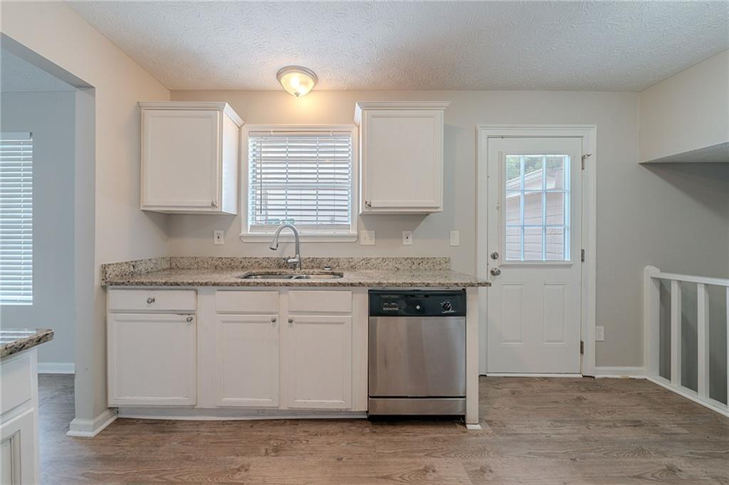 2183 Ramblewood Circle Decatur, GA 30035 - Photo 4 of 37 a kitchen with granite countertop cabinets stainless steel appliances and a sink
