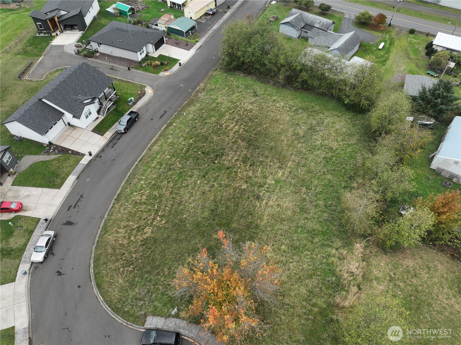 an aerial view of a residential houses with outdoor space