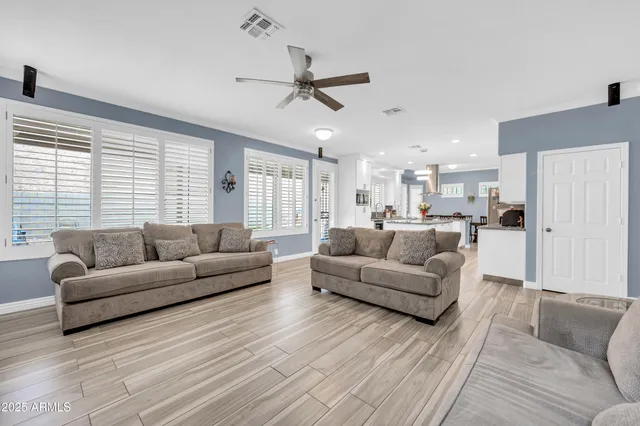 a view of a dining room with furniture and wooden floor
