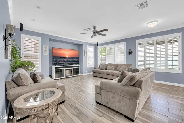 a view of a dining room with furniture and a potted plant