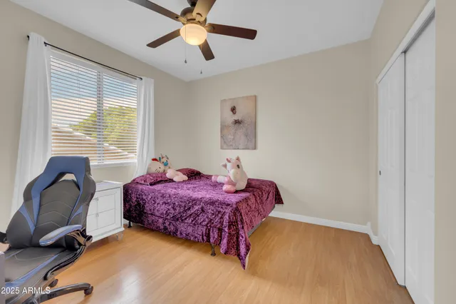 a bathroom with a granite countertop sink a mirror and a shower