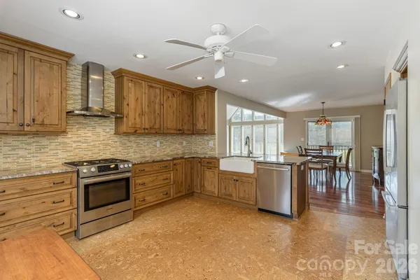 a kitchen with lots of counter top space and appliances
