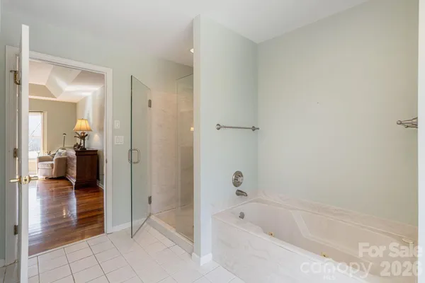 a bathroom with a bathtub and a shower