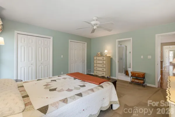 a bedroom with a bed and dresser