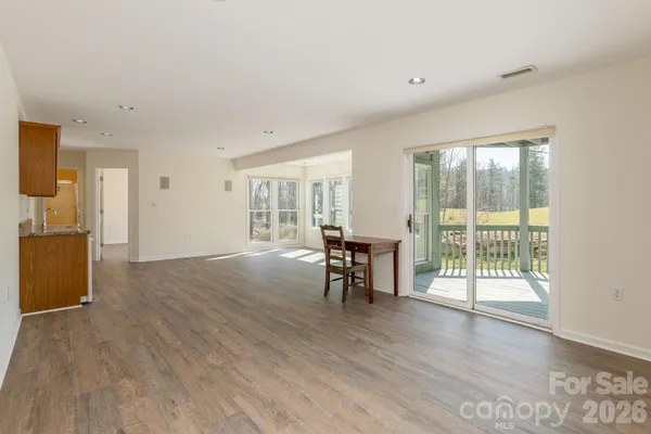 a view of a livingroom with furniture window and wooden floor
