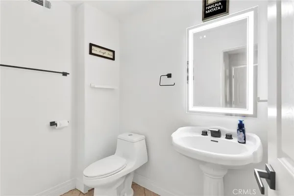 a bathroom with a sink a toilet and a bathtub