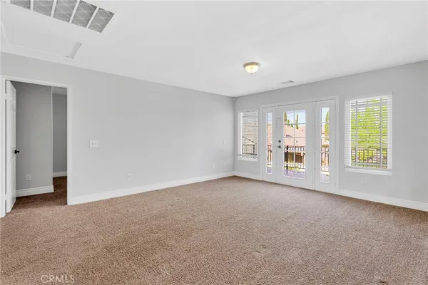 a spacious bathroom with a double vanity sink mirror and bathtub