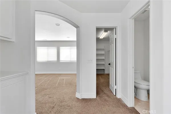 an aerial view of a house with a yard and seating space