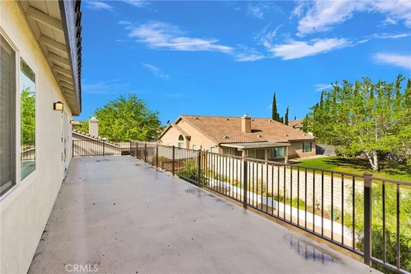 an aerial view of a house with large trees