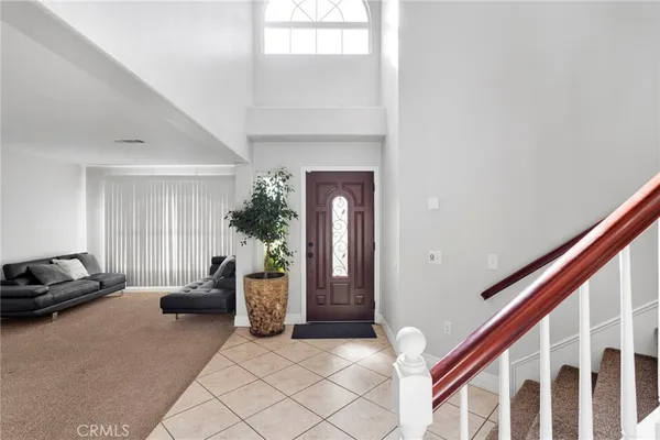 a view of livingroom and dining room with a couch