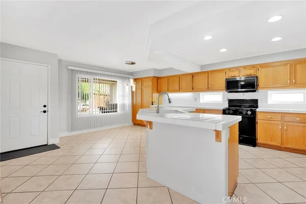 a bedroom with a bed and flat screen tv