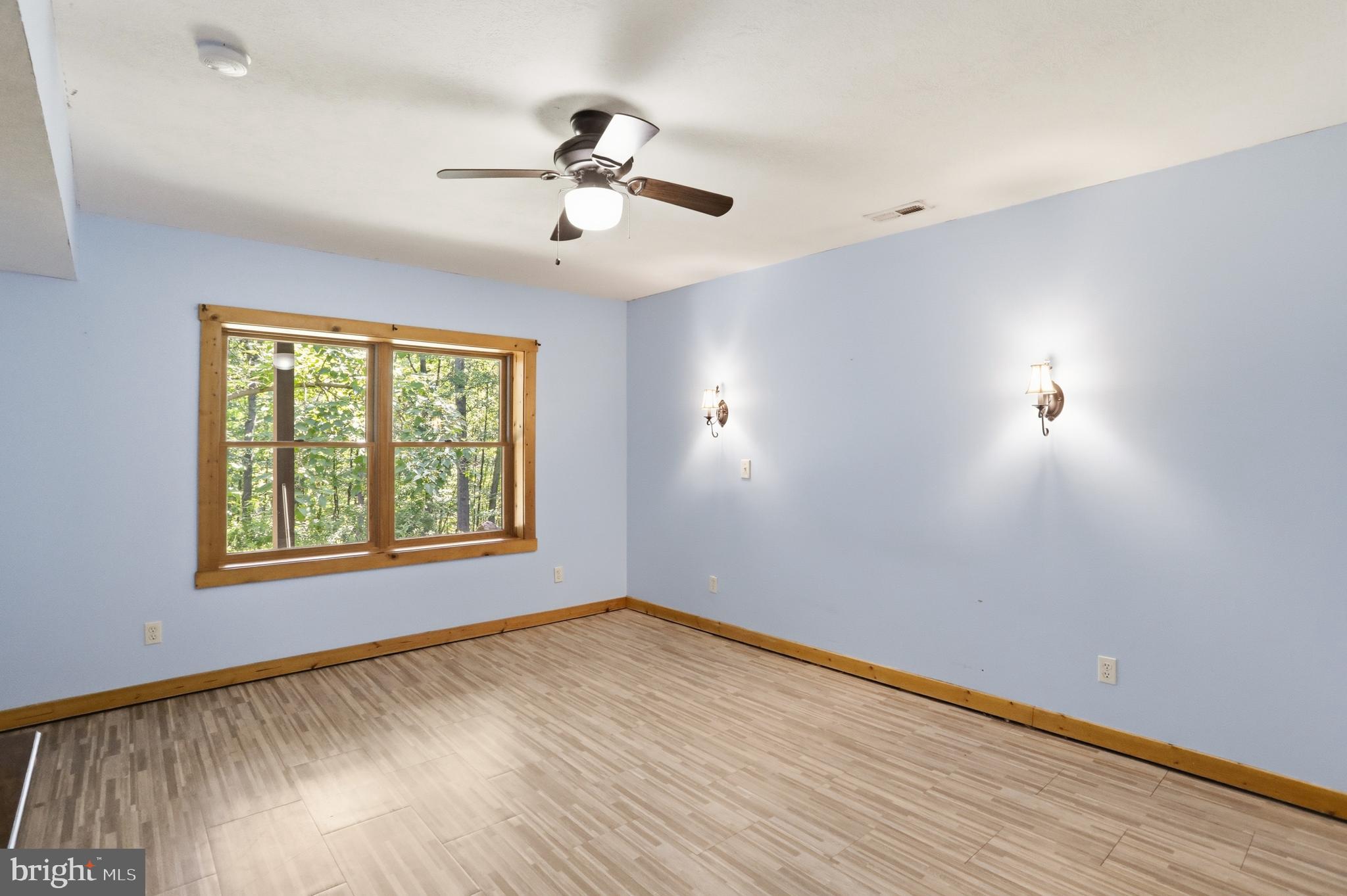 1400 Core Road Romney, WV 26757 - Photo 31 of 73 a view of an empty room with wooden floor and a window