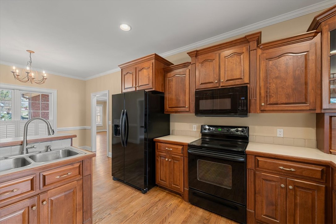 128 Cayman Way Anderson, SC 29621 - Photo 12 of 48 This spacious kitchen offers ample cabinet storage and a practical layout.