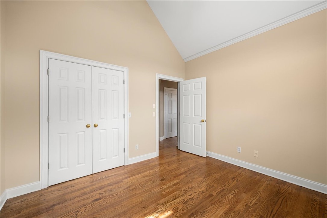 128 Cayman Way Anderson, SC 29621 - Photo 27 of 48 This airy room features rich hardwood flooring and elegant vaulted ceilings.