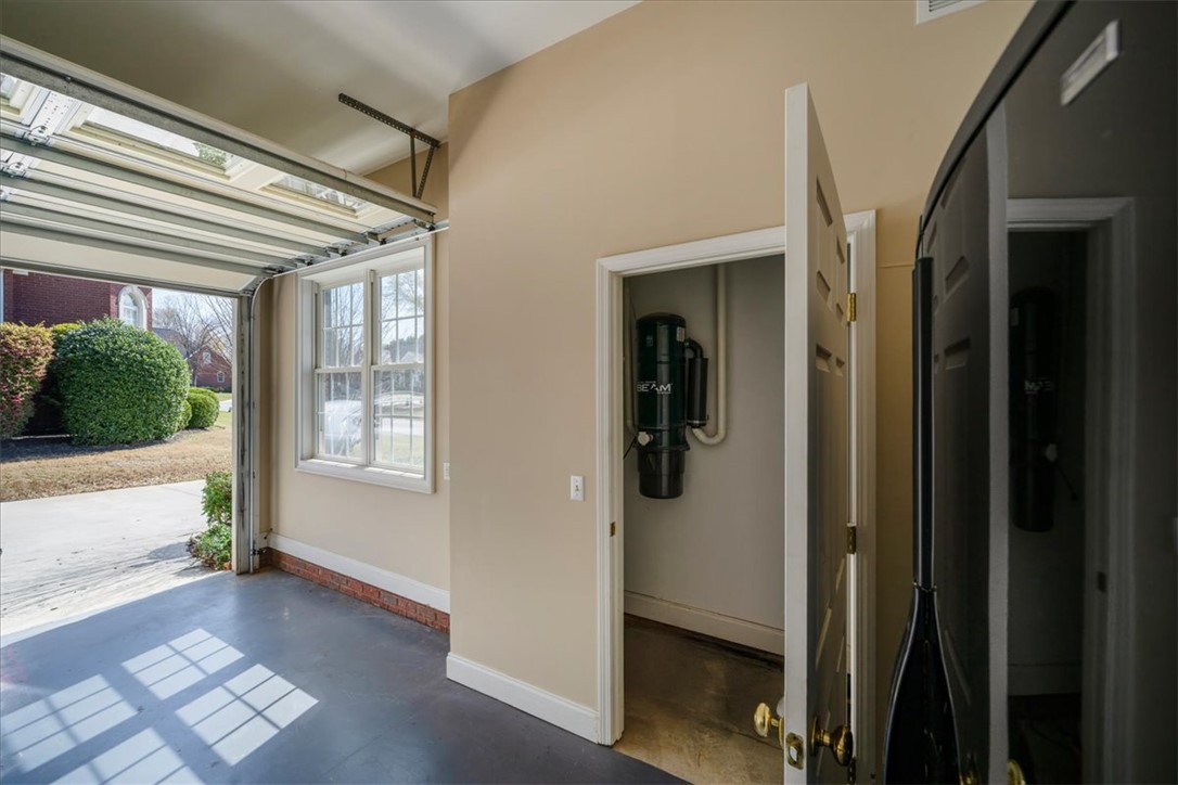 128 Cayman Way Anderson, SC 29621 - Photo 33 of 48 This bright garage features an open door, a window for natural light, and a central vacuum system.