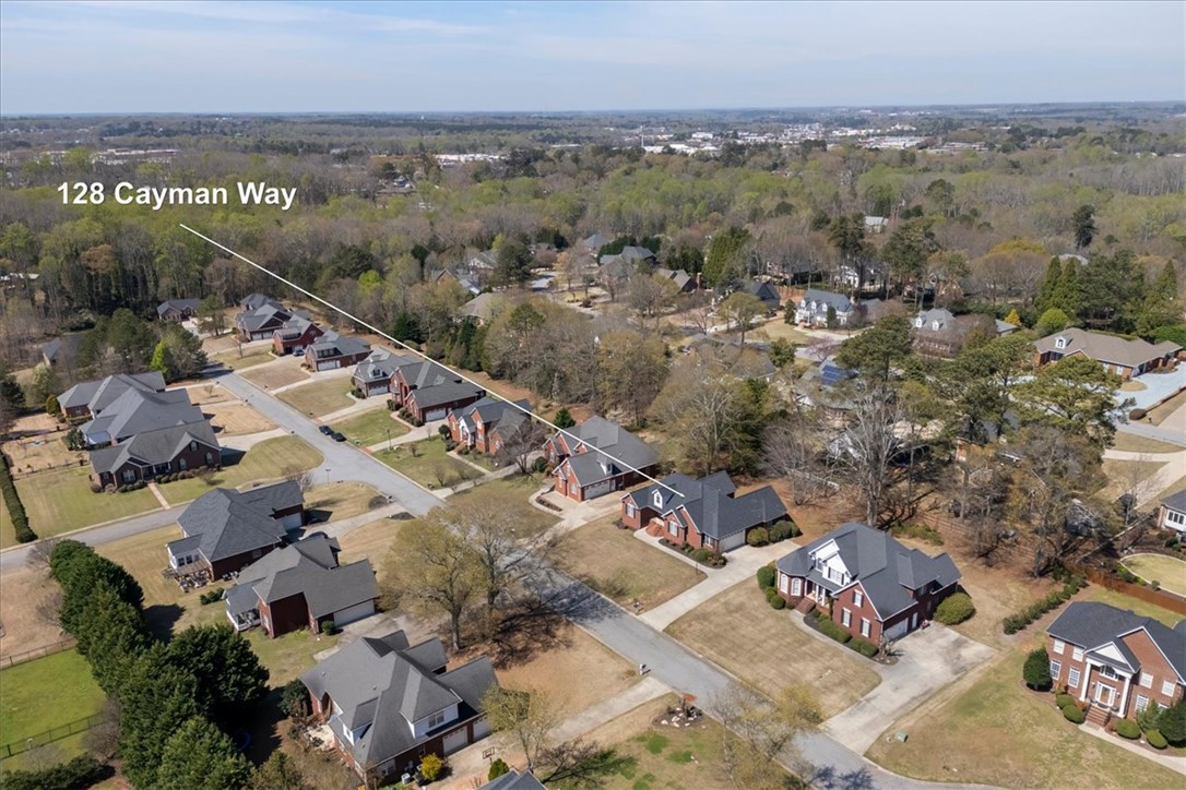 128 Cayman Way Anderson, SC 29621 - Photo 40 of 48 An aerial view captures the neighborhood's residential charm and natural surroundings.