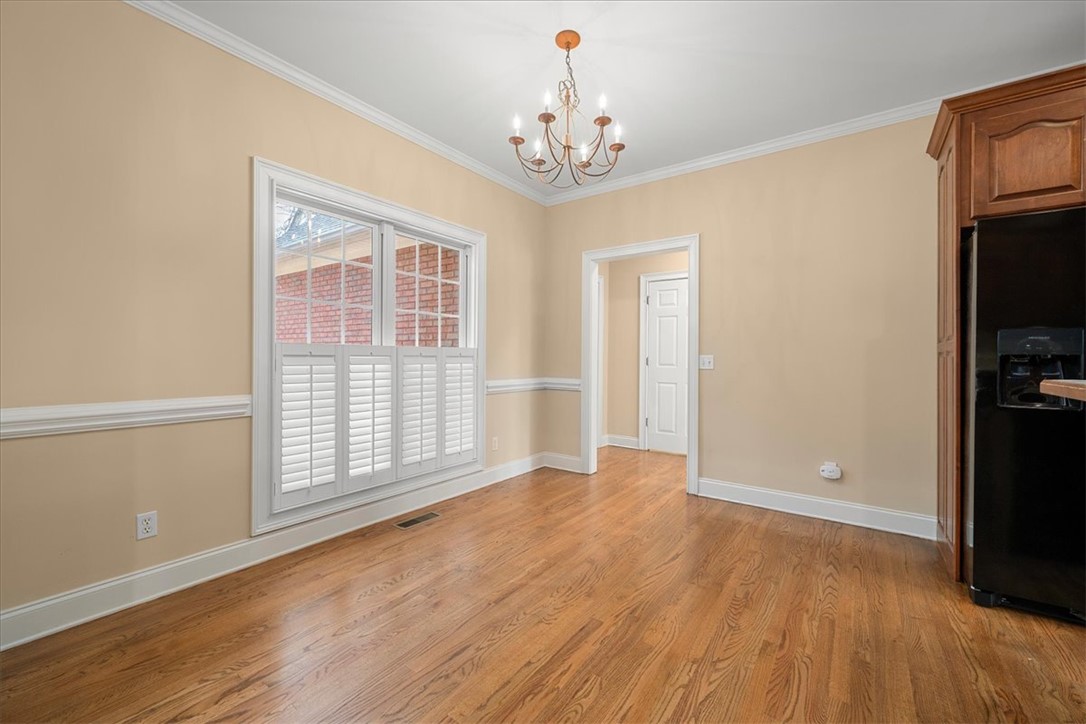 128 Cayman Way Anderson, SC 29621 - Photo 10 of 48 This inviting dining area features elegant hardwood floors and abundant natural light.