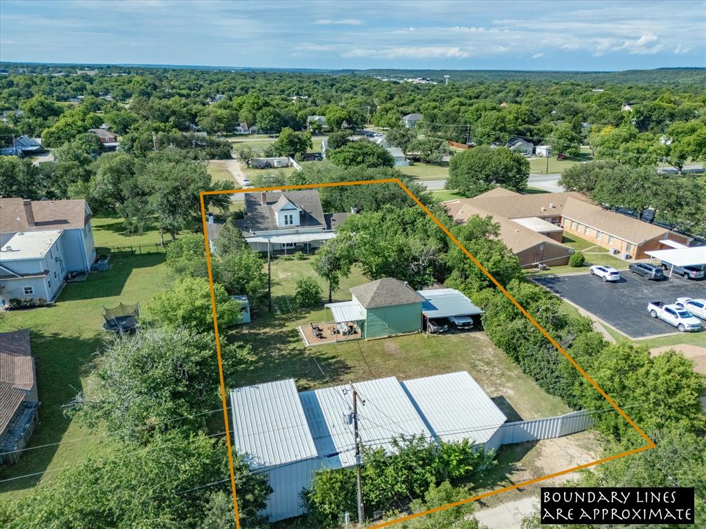 907 4th Street Graham, TX 76450 - Photo 33 of 34 an aerial view of a house with a garden
