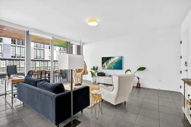 a kitchen with a table chairs and a counter top space