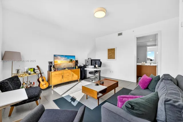 a bathroom with a double vanity sink toilet and shower