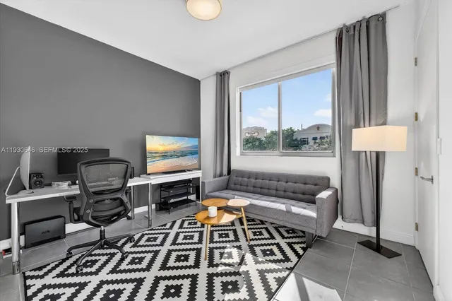 a room with furniture and flat screen tv