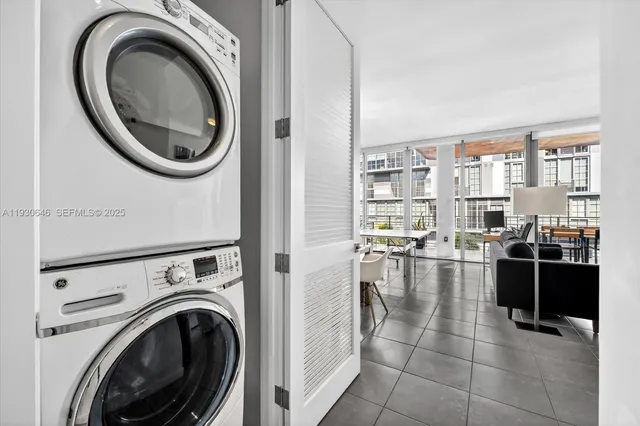 a roof deck with table and chairs