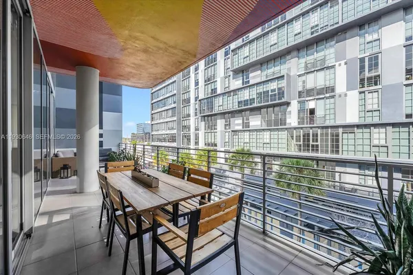 a view of a balcony with a couple of chairs