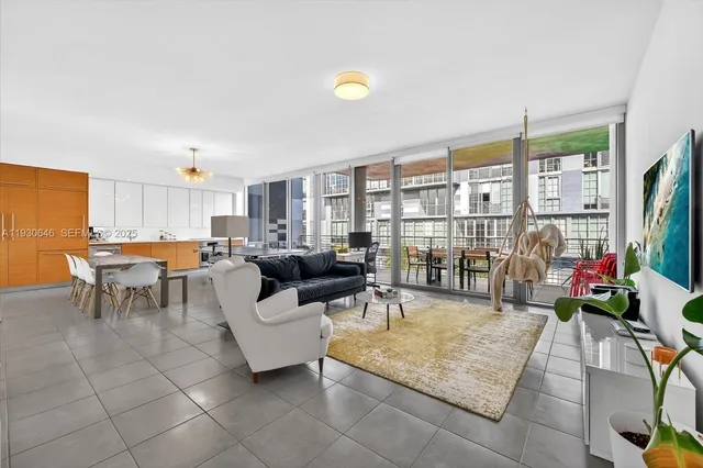 a living room with lots of furniture and a table
