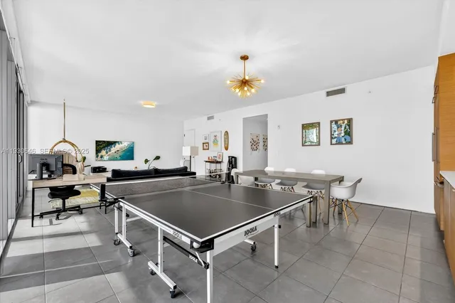 a kitchen with stainless steel appliances granite countertop a sink a counter space and cabinets