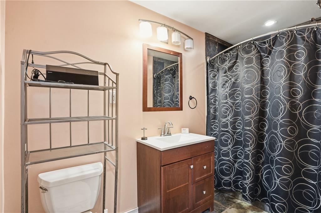 8926 Ashton Road Jonesboro, GA 30238 - Photo 12 of 32 a bathroom with a sink and a mirror