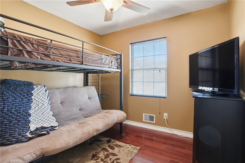 8926 Ashton Road Jonesboro, GA 30238 - Photo 13 of 32 a bedroom with furniture and flat screen tv